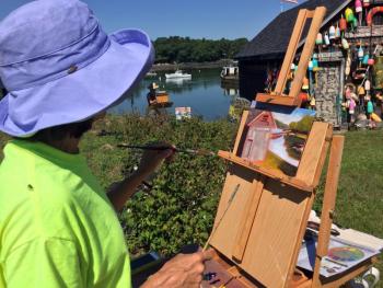 Leslie Piercy, from Rockland, was one of the plein air painters working across the road from at Knickercane Island on July 13. SUZI THAYER/Boothbay Register