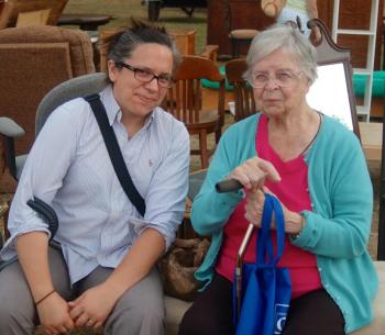 Mary Roach and 100-year-old Valerie Smith rest on an auction bench. ART MAYERS/Boothbay Register