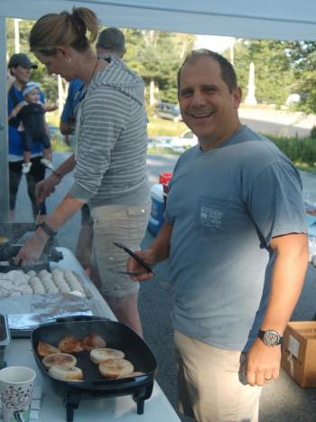 Bruce Harris and Amy Hillstrom prepare breakfast muffins to benefit Southport Central School. ART MAYERS/Boothbay Register