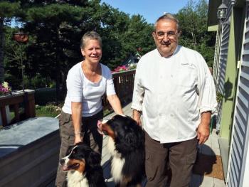 Roni and Mario De Pietro at their home with their dogs, Rosie and Max. SUZI THAYER/Boothbay Register