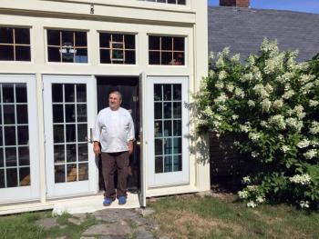 Mario De Pietro at the entrance to the Squire Tarbox Inn & Restaurant. SUZI THAYER/Boothbay Register