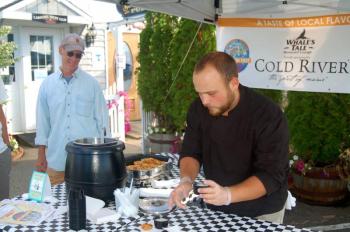 Joe Bowman prepares complimentary chowder and a biscuit at Whale’s Tale. ART MAYERS/Boothbay Register
