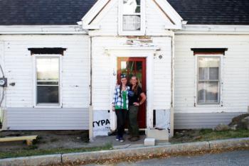 Pam Logan stands in the doorway of the Tiny House with her daughter, Maddie Brown, who will inherit it. Courtesy of Pamela Logan
