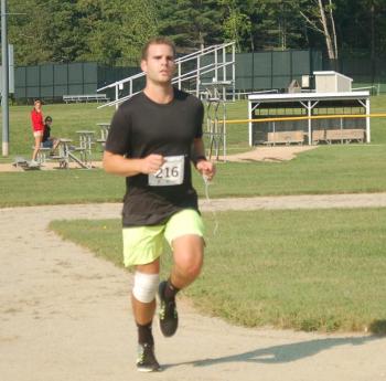 Allan Surette finishes strong as winner of the 5k race on Sunday. ART MAYERS/Boothbay Register