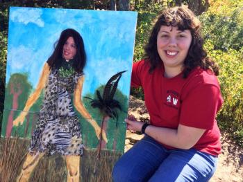 Barbara Welborn holds her self portrait, “Jungle Prom.” SUZI THAYER/Boothbay Register