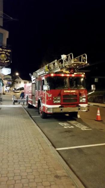A crew of firemen and town employees were in town on Oct. 25 helping businesses get ready for the Boothbay Festival of Lights. Courtesy of Andy Bielli