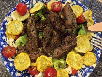 You can throw anything you like on a hot salad. Here’s one with roasted summer squash. SUZI THAYER/Boothbay Register