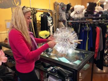 Adele Bielli of Slick’s makes one of the 25 globe lights she and her sister, Andy, made to adorn the shop for the Boothbay Festival of Lights. SUZI THAYER/Boothbay Register