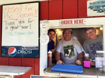 Owen Sterrs, left, Gary Starankewicz and Earle Tourtillotte say sayonara to their patrons from the summer of 2016 by throwing a fabulous feed at Dunton’s Doghouose in Boothbay Harbor. SUZI THAYER/Boothbay Register