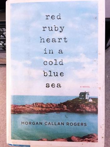 The original book cover of “Red Ruby Heart in a Cold Blue Sea” grabbed my attention at the library.