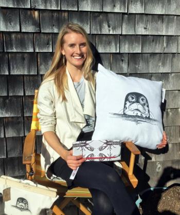 Morgan Mitchell holding one of her new homegoods designs on the deck off Calypso in Boothbay Harbor. SUZI THAYER/Boothbay Register