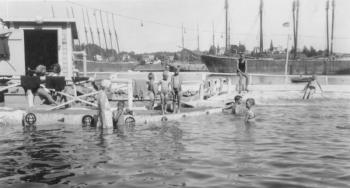 Bill Farmer built the West Harbor saltwater swimming pool in 1927. Other recreational offerings he put on his property were an ice skating rink and a miniature golf course. Forming a backdrop to the pool are mothballed schooners awaiting a future use. The shot was probably taken in the 1930s. Courtesy of the Boothbay Region Historical Society