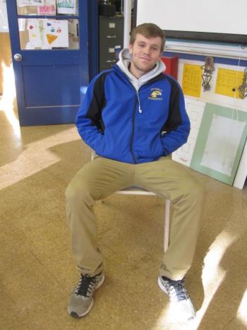 BRHS student and seat technician Carter Babcock relaxes on one of the chairs he helped make. MORGAN CALLAN ROGERS/Boothbay Register
