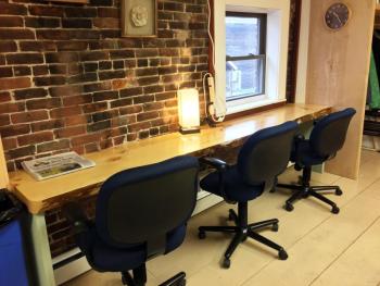 A work station in the modern, light-filled new business in Damariscotta, BUZZ MAINE. SUZI THAYER/Boothbay Register