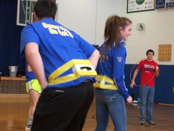 Jacob Bishopp and Faith Blethen try to shake ping pong balls out of a duct-taped empty tissue container while Hayden Brewer looks on. This was a tough contest. MORGAN CALLAN ROGERS/Boothbay Register
