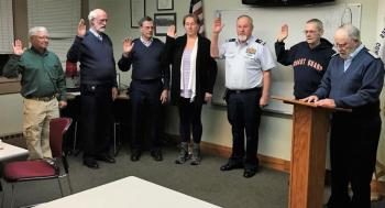 Each January USCG Auxiliary Flotilla 25 swears-in the leadership and staff officers for the coming year. Administering the oath of office is Commodore Robert Johnson, far right, to, from left, Ray Freedell, Jerry Homer, David Eastwood, Earlene Ingram, Dave Power and Jim Powers. Flotilla Commander Eastwood and Flotilla Vice Commander Homer may serve only two years in office, and while staff officers have no term limits as they’re formally reappointed annually. Courtesy of USCG Auxiliary