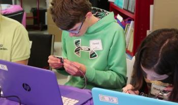 Forest Holbrook, a student at the Center for Teaching and Learning, attaches a text display device to his gizmo. Courtesy photo