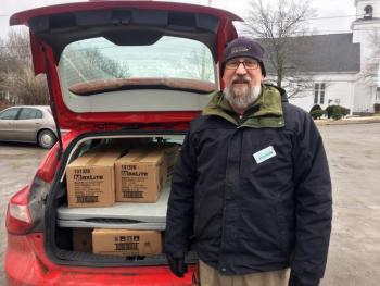Efficiency Maine representative Steve Granholm can usually be found distributing LED light bulbs whenever the Good Shepherd Food Mobile comes to town. SUZI THAYER/Boothbay Register