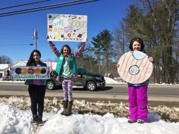 Scouts from Girl Scout Troop 144 were out in force peddling cookies while Burgers&Freys peddled its burgers in Damariscotta on March 18. SUZI THAYER/Boothbay Register