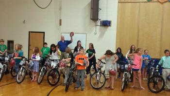 In one of his many lives, Stuart Smith works with the Bikes for Books program. Courtesy of Stuart Smith