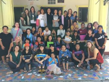 Marty Helman and Julie Lamy (both right side of photo) join the growing Sunflower House families for a reunion and group photo in Chiang Rai. Courtesy photo