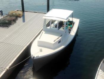 The Electra, a 23-foot electric lobster boat, in the water in Boothbay Harbor. Courtesy of Eric Graves/Boothbay Harbor Shipyard