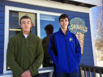 Tristan Mercier, left, and Elijah Gudroe man the ice cream stand, Sarah’s Scoops, on opening day 2017, St. Patrick’s Day. SUZI THAYER/Boothbay Register