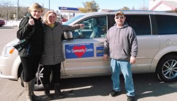 Jane Good, left, thanks Stephanie Hawke and Alan Williams, Hawke Motors manager, for contributing free service for the Center’s van. Courtesy of the Community Center
