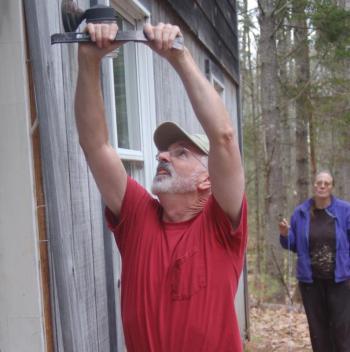 Mike Reed replaces a door frame at a house in Edgecomb. ART MAYERS/Boothbay Register