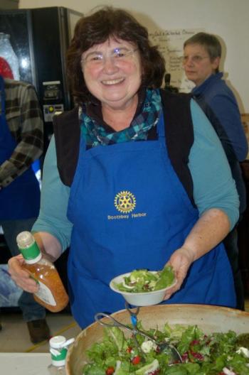 Rotary Volunteer Irene Bowle serves up salads. ART MAYERS/Boothbay Register