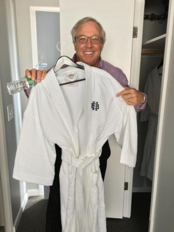 Paul Coulombe shows off one of the luxurious bathrobes that are provided in the rooms at the Boothbay Harbor Oceanside Golf Resort. SUZI THAYER/Boothbay Register
