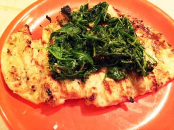 Sautéed arugula on grilled chicken breast. SUZI THAYER/Boothbay Register