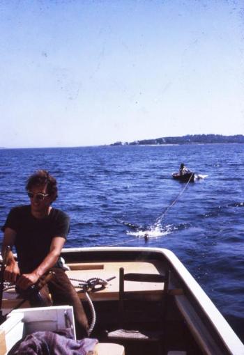 Friend and deckhand Bill Coyne at the helm. That’s me in the dinghy. Photo property of Suzi Thayer