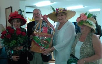 And the winner is! Geraldine, left, and Jim Botti receive their Derby raffle prizes. JANE CARPENTER/Boothbay Register
