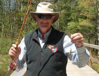 Catch of the Day. With no youth to teach, fly fisherman Steve Rubicam settles for catching minnows. ART MAYERS/Boothbay Register