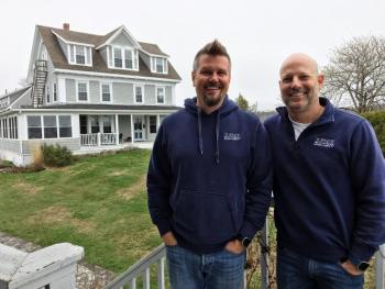 Buzz Makarewicz, left, and Mark Osborn in front of their Boothbay Harbor business, Topside Inn. SUZI THAYER/Boothbay Register