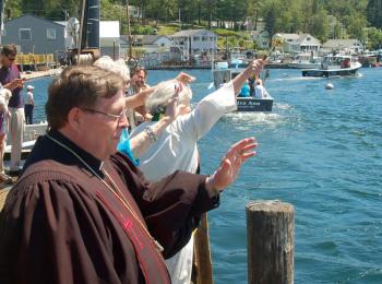 Local clergy bless the boats. ART MAYERS/Boothbay Register