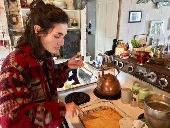 Sophia makes sure the corn bread is to her liking. SUZI THAYER/Boothbay Register