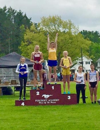 Angie Perkins on the podium at the state championship track meet at Dover-Foxcroft. Perkins won both the MVC and state Class C Title for high jump. Courtesy of Angie Perkins