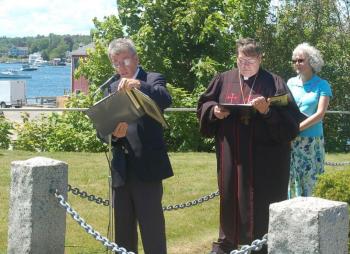 John O’Connell and the Reverend Richard Rego read from the list of fishermen lost at sea. ART MAYERS/Boothbay Register