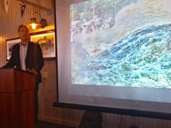 Jonathan White speaks about his book, “TIDES: The Science and Spirit of the Ocean,” at the Boothbay Harbor Yacht Club on June 23. SUZI THAYER/Boothbay Register