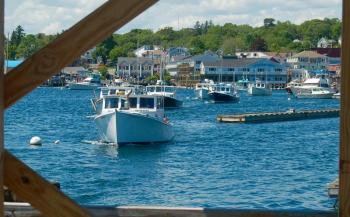 A parade of fishing boats approaches the fish pier to be blessed. ART MAYERS/Boothbay Register