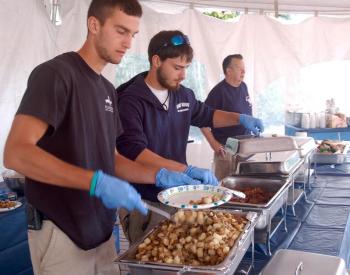 Evan Hepburn and Jesse Peters serve up breakfast to benefit the Boothbay Harbor Fire Department. ART MAYERS/Boothbay Register