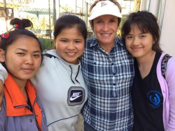 FTD co-founder, Jane McBride, smiles for the camera with three “Daughters” from Friends of Thai Daughters’ Sunflower House in Chiang Khong, Thailand. Honey, far right, will travel to Maine for her first international trip in support of the August 4 Sunflower Celebration in Damariscotta. Courtesy photo