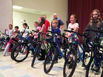 2017 Bikes for Books winners at Edgecomb Eddy School are, from left: Charlotte Abello, Ethan Clark, Morganne Phelps, Abbie Clark, Aliyah Bowley, Takoda Dionne, Hannah Abello and Anna Gosselin. Not pictured are fellow winners Silas Lehouillier, Emily Gosselin and Lydia Currier. SUZI THAYER/Boothbay Register
