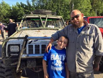 Winner of the dirtiest Jeep at the 11th annual Jeep Night at Newcastle Chrysler Dodge Jeep Ram Viper was Woolwich’s Donald Bowling, pictured here with his son, Payson. SUZI THAYER/Boothbay Register