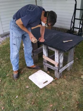 Stone artists and artisans, like stone carver Jon Doody pictured here, will be visiting the Boothbay Railway Village throughout the month of August. Courtesy of Margaret Hoffman