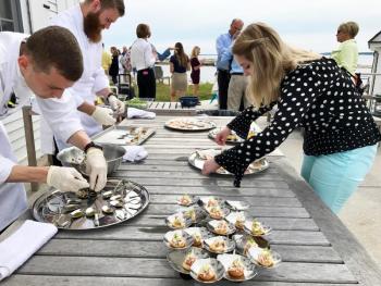 Serving hors d’oeuvres on the terrace at the Cuckolds Inn and Lighthouse. Courtesy of Michelle Amero