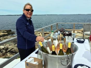 Kim Foye serves wine, cocktails and soft drinks on the terrace of the inn. SUZI THAYER/Boothbay Register