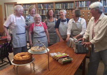 Southport Library Aides enjoy a good laugh before getting to work sorting books and baking pies for the upcoming Book and Bake Sale at the Southport Library on Friday, Aug. 4. Pictured from left are Barb Lally, Marie Oates, Nan Jackson, Anne Gobes (Aides president), Kathy Bugbee, Sandra Seifert and Jean Hawley. Courtesy of Helen Meserve
